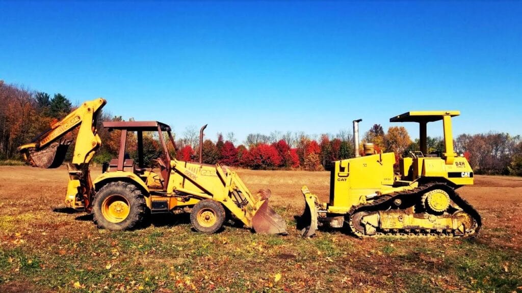 Dozer vs Backhoe Loader